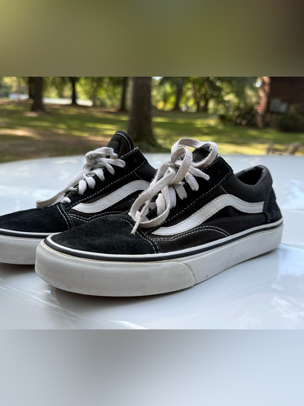 Women’s black and white Vans